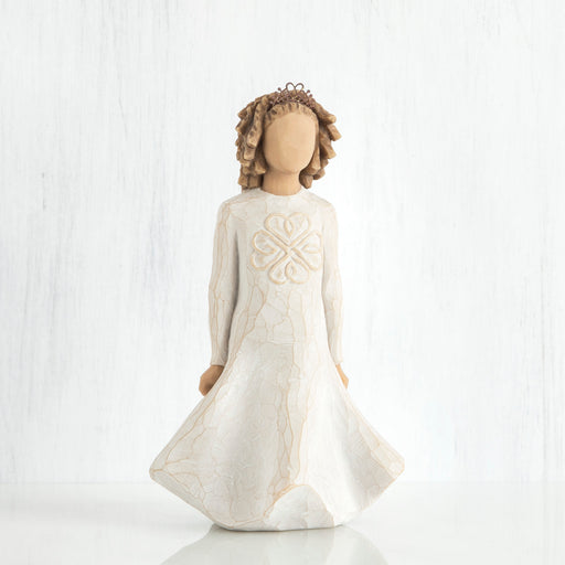 Decorative angel figurine with a white dress on a white background