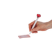 Hand holding a pen with a heart-shaped clip and a small pink notepad on a white background