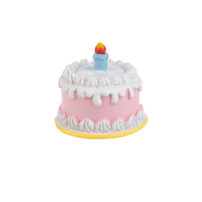 Charm birthday cake with pink base, white frosting, and a single candle on a white background