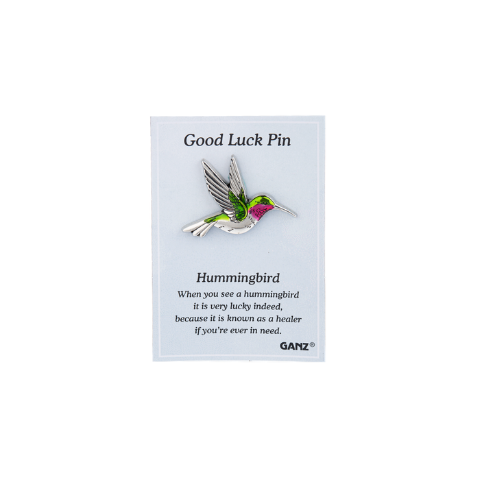 Good luck pin shaped like a hummingbird on a Ganz branded card with text.