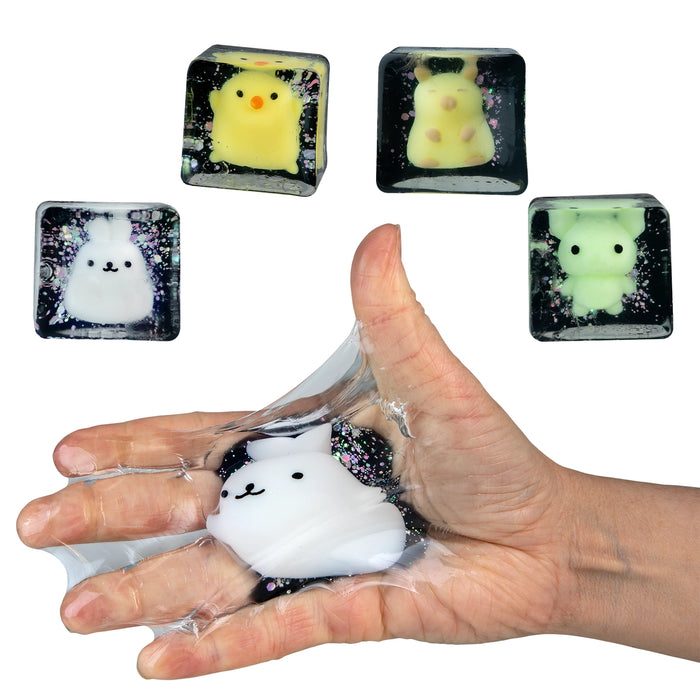 Squishy toy with cute animal designs held in a hand against a white background