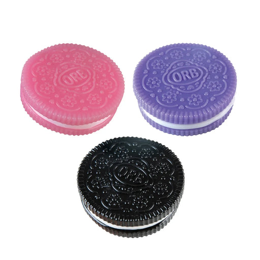 Three Orb cookies in pink, purple, and black on a white background