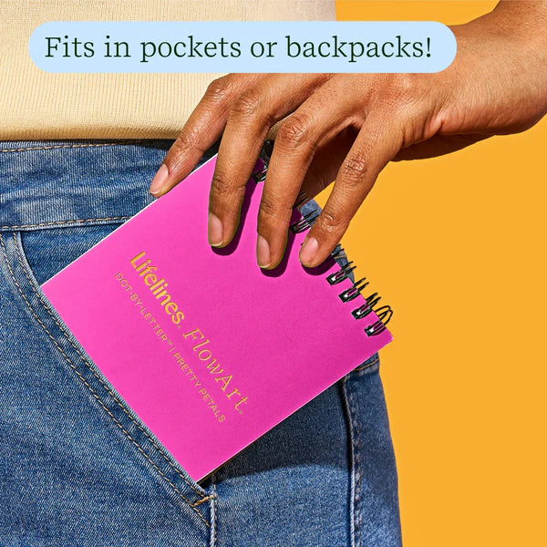 Person placing a pink notebook into their pocket with text indicating it fits in pockets or backpacks.