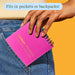Person placing a pink notebook into their pocket with text indicating it fits in pockets or backpacks.