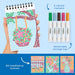 Coloring book with markers and storage tray on a blue background