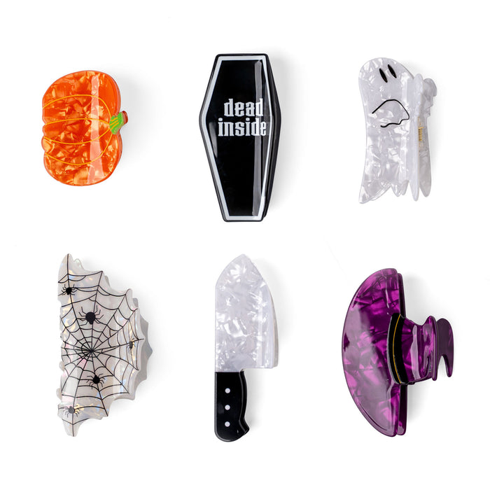 Set of Halloween-themed phone holders on a white background