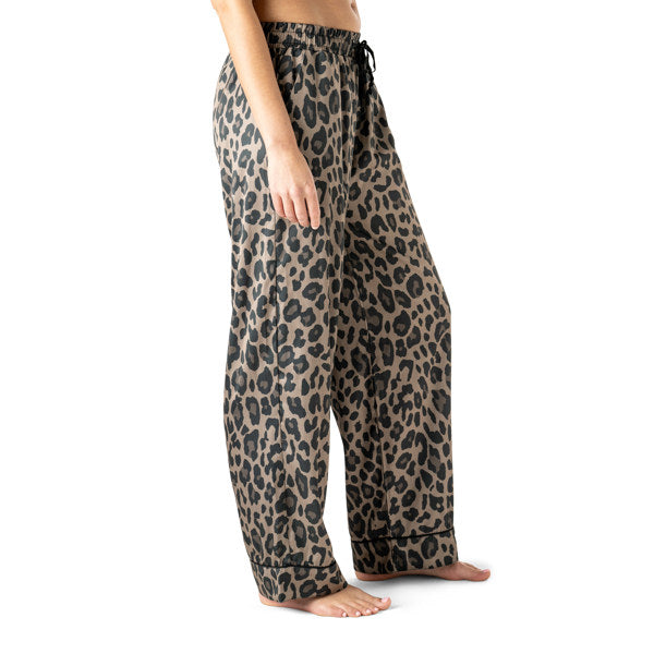 Leopard print pajama pants worn by a person on a white background