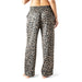 Leopard print pajama pants worn by a person on a white background