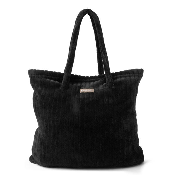 Black textured tote bag with a visible brand label on a white background