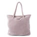 Pink textured tote bag on a white background