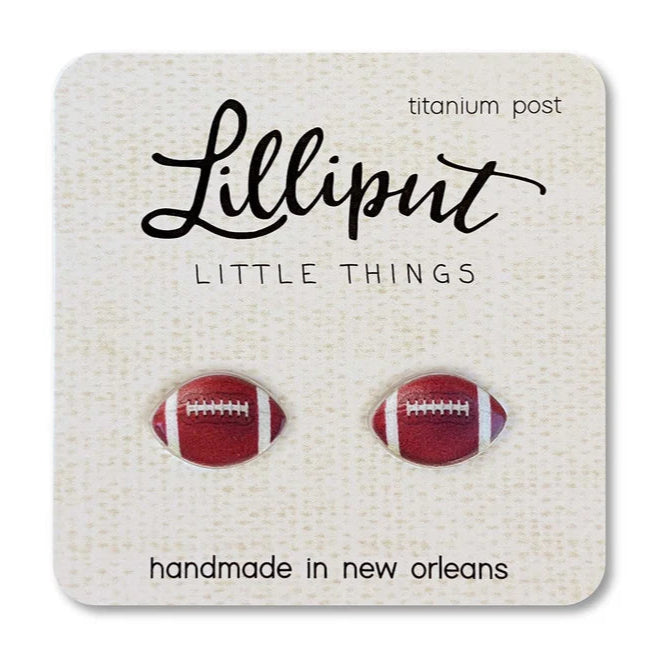 Football-shaped earrings on a Lilliput Little Things card with 'handmade in New Orleans' text.