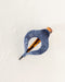 Decorative pen with blue bandana pattern on a white background
