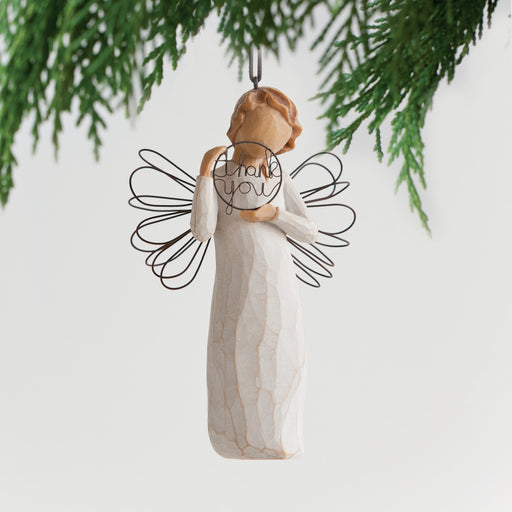 Angel in cream dress with wire wings, holding words 'thank you' written in wire inside wire circle. Hook and loop affixed to figure's head