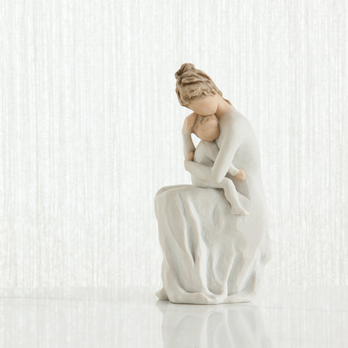 Statue of a woman in a flowing dress on a white background