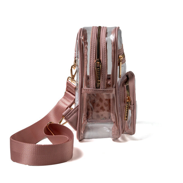 Clear handbag with pink strap and interior, on a white background