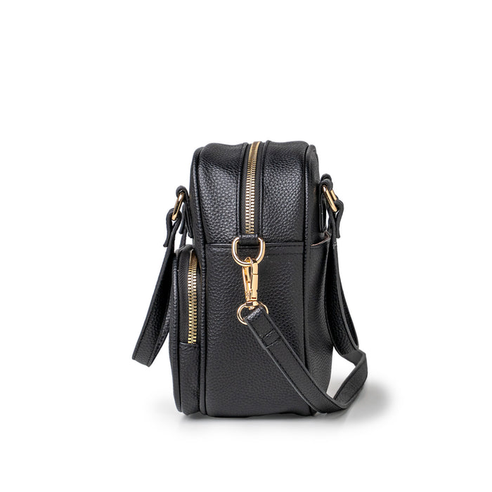 Black leather handbag with gold zippers on a white background