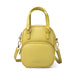 Yellow handbag with a strap on a white background