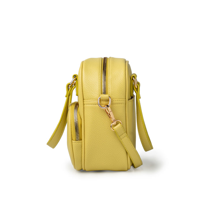 Yellow backpack with gold zippers on a white background