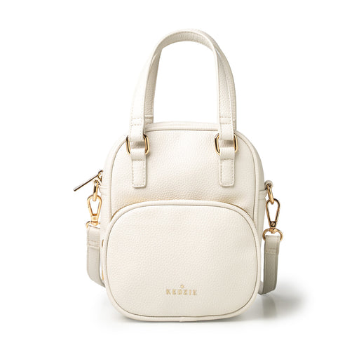 White handbag with gold accents on a white background
