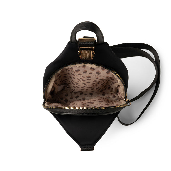Black backpack with leopard print interior on a white background