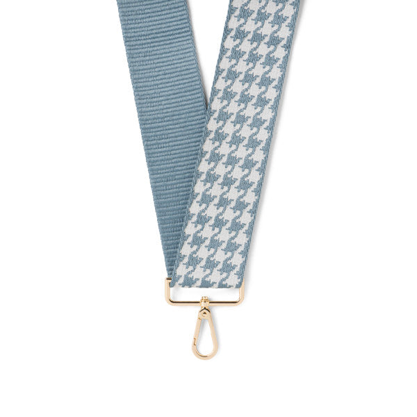 Two fabric straps, one solid blue and one houndstooth patterned, on a white background.