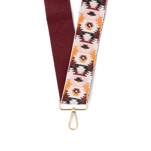 Patterned strap with gold clasp on a white background