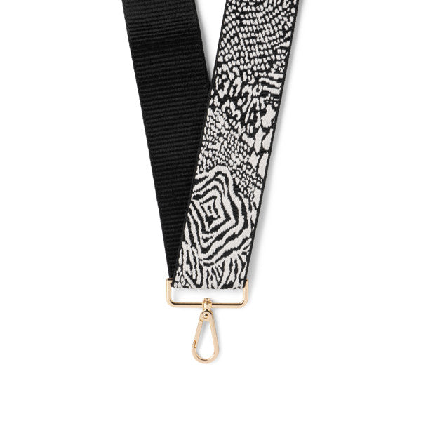 Black and white patterned strap with gold clasp on a white background