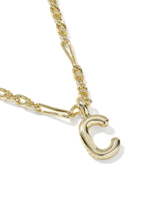 Gold necklace with a letter 'C' pendant on a white background