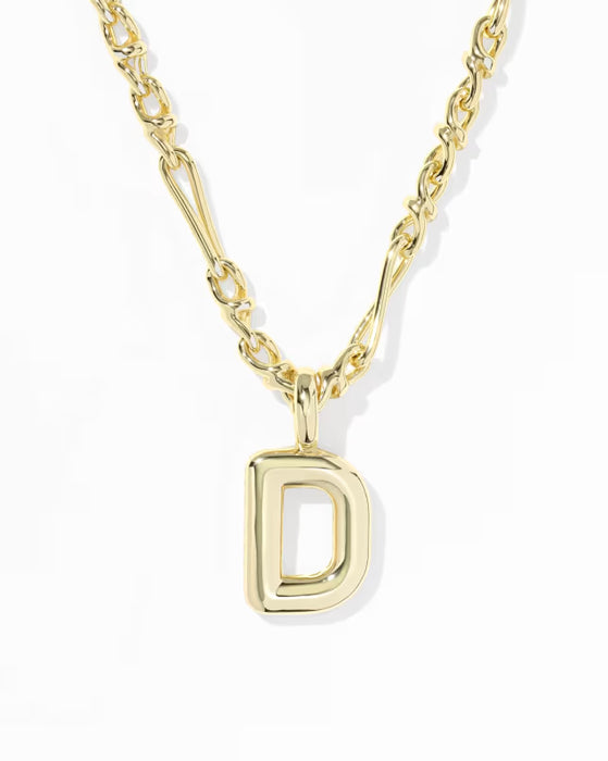 A gold initial necklace featuring a polished, open capital letter 'D' pendant on a matching gold chain, photographed against a clean white background.