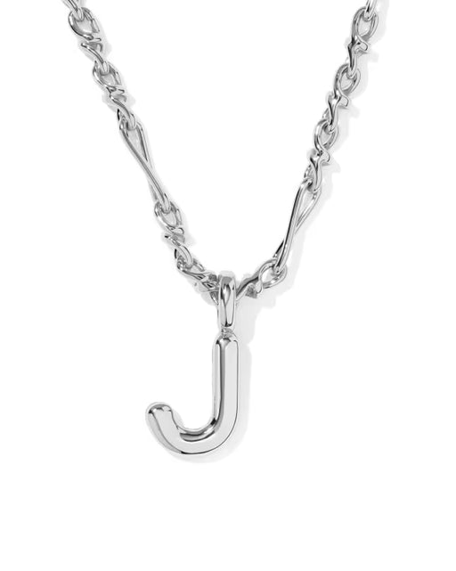 A silver initial necklace featuring a polished lowercase 'j' pendant on a matching chain, shown against a plain white background.
