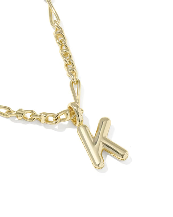 Gold necklace with a 'K' pendant on a white background