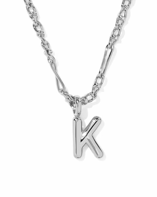 A silver initial necklace featuring a polished letter 'K' pendant on a silver link chain, shown against a plain white background.