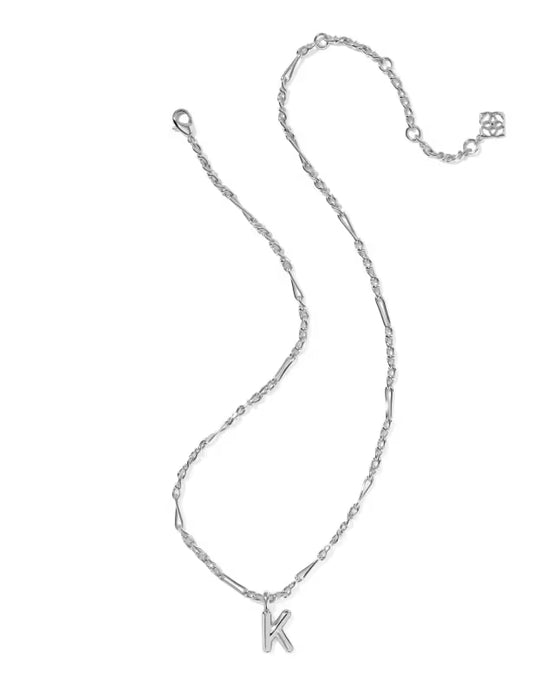 A silver chain necklace featuring a delicate, openwork letter 'M' pendant, displayed on a clean white background.
