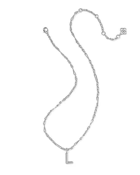 Gold necklace with a 'S' pendant on a white background