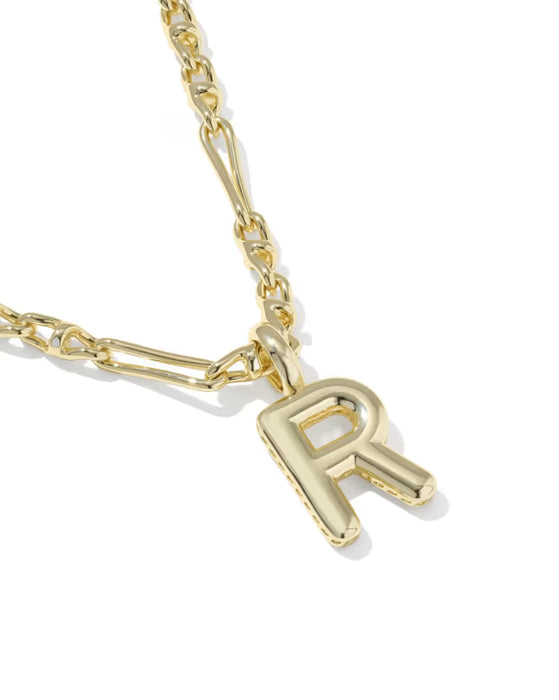 A close-up of a gold chain necklace featuring a polished, openwork capital letter 'R' pendant, set against a clean white background.