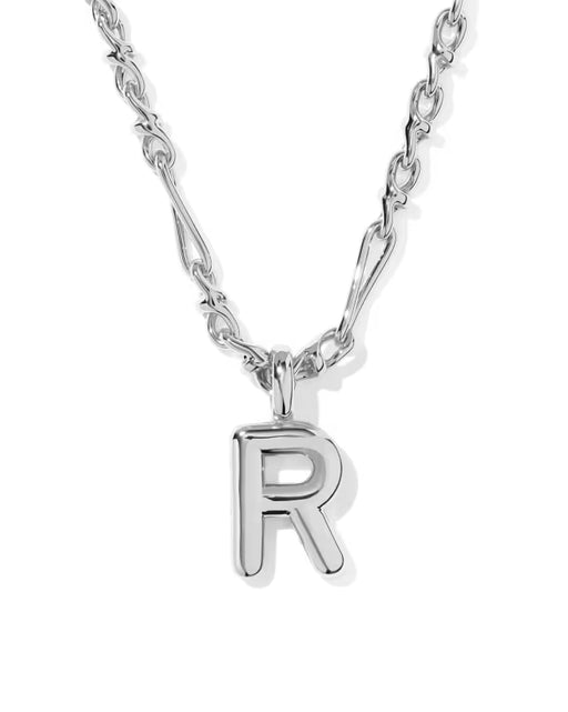 A silver initial necklace featuring a polished capital letter 'R' pendant on a silver link chain, shown against a plain white background.