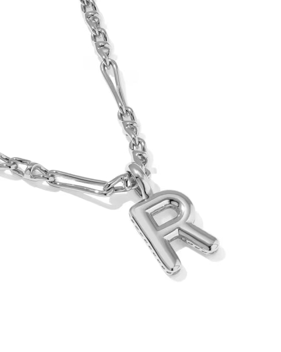 A silver-toned initial necklace featuring a polished capital letter 'R' pendant on a matching chain, shown against a clean white background.