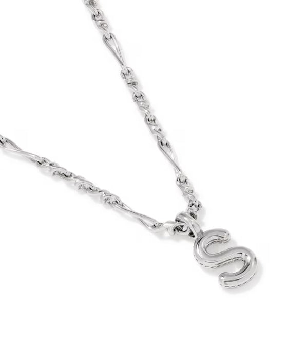 A silver chain necklace featuring a polished cursive letter 'S' pendant, shown against a plain white background.