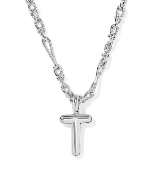 A silver necklace featuring a polished T-shaped initial pendant on a multi-link chain, shown against a plain white background.