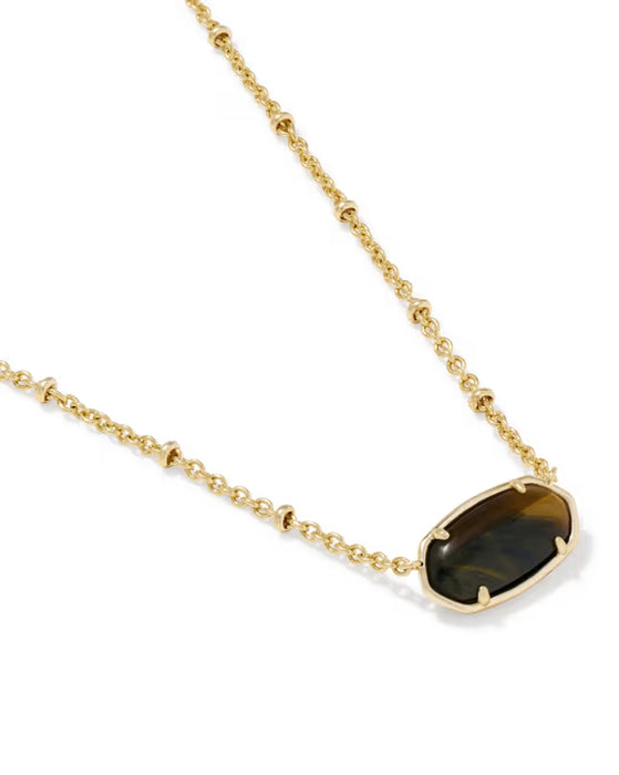 A gold chain necklace featuring a polished gold bezel-set oval stone with a dark brown and black tiger's eye pattern, shown on a clean white background.
