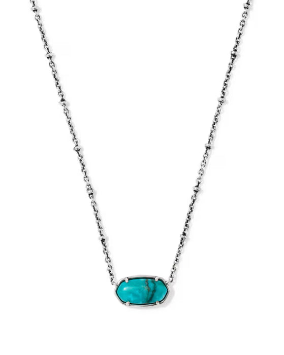 A silver-toned beaded chain necklace with an oval turquoise cabochon pendant, shown against a plain white background.