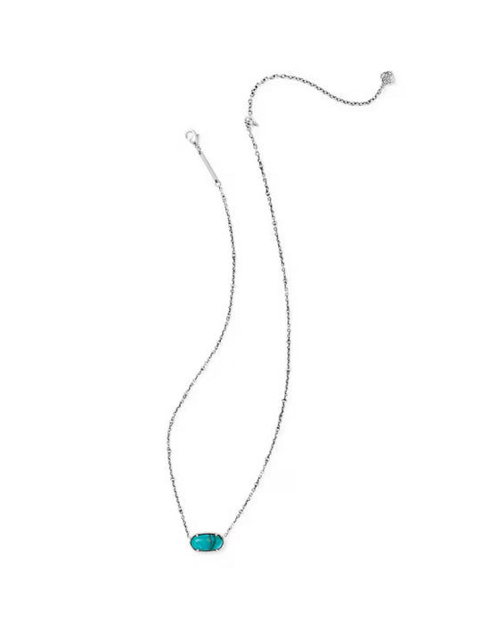 A delicate silver chain necklace featuring a small, horizontally oriented oval turquoise gemstone pendant, displayed on a clean white background.