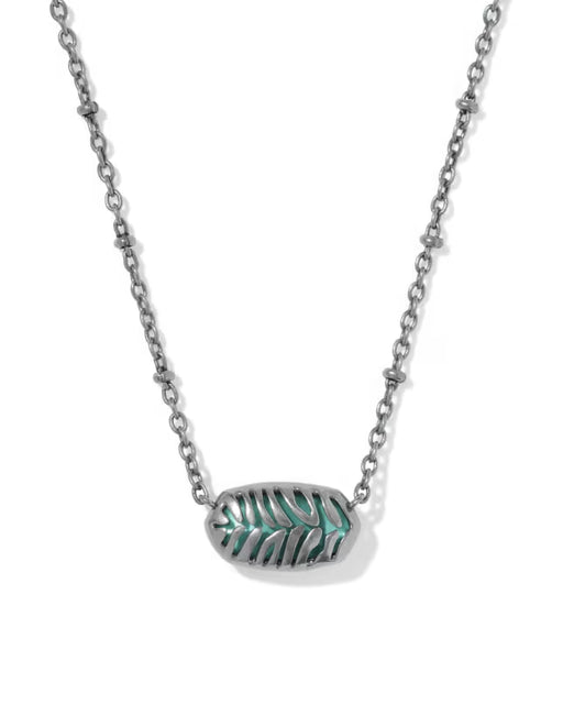 A silver-toned chain necklace featuring an oval pendant with a textured, leaf-like pattern filled with turquoise green inlay, shown against a plain white background.