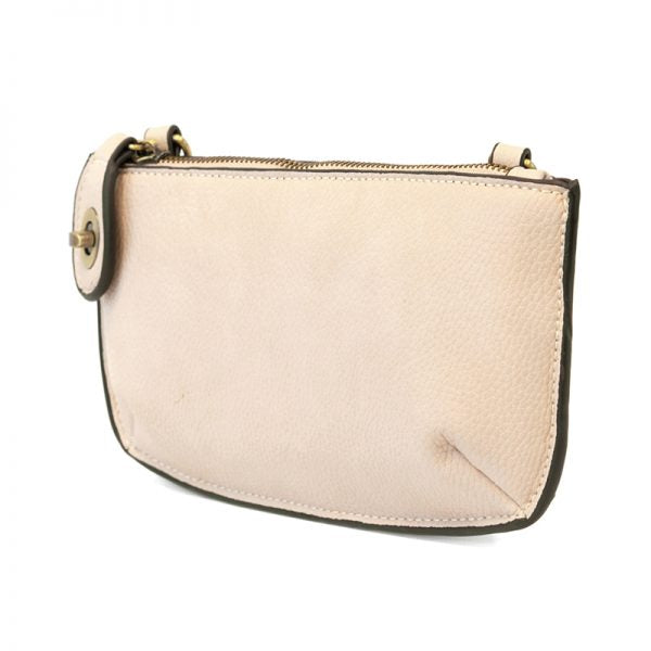Beige handbag with a gold zipper on a white background