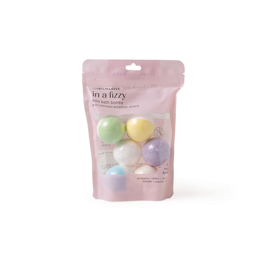 Pink packaging of 'in a fizzy' mini bath bombs with colorful bath bombs on a white background