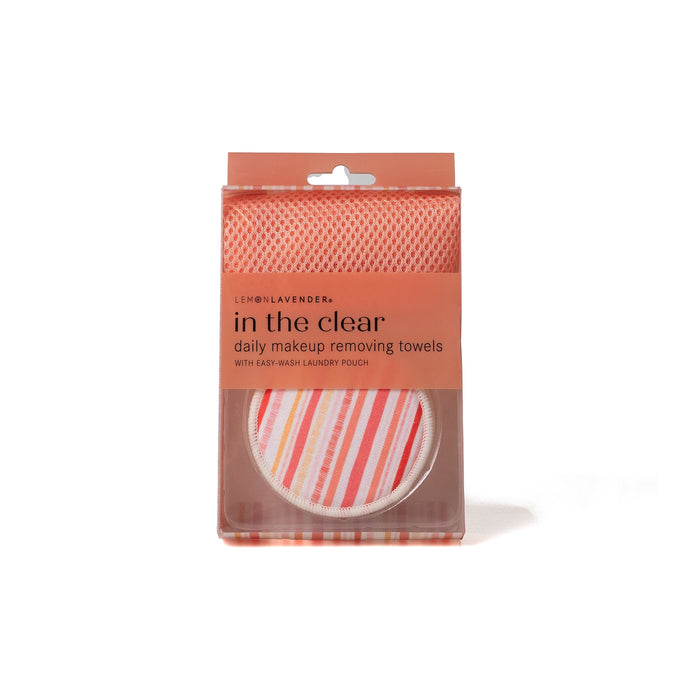 Packaged daily makeup removing towels with a clear and striped design on a white background.