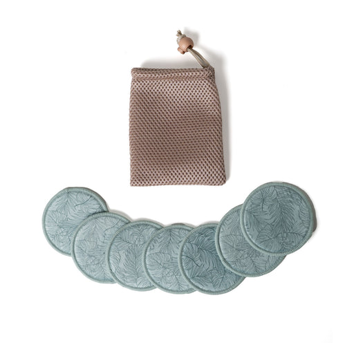 Set of six green leaf-patterned coasters with a woven pouch on a white background