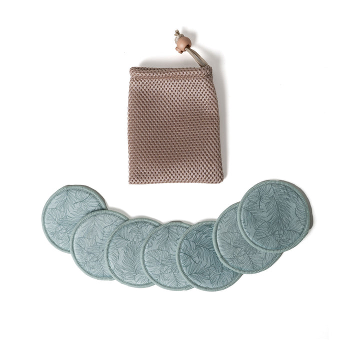 Set of six green leaf-patterned coasters with a woven pouch on a white background