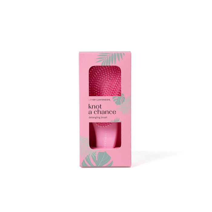 Pink product packaging with 'knot a chance' text on a white background