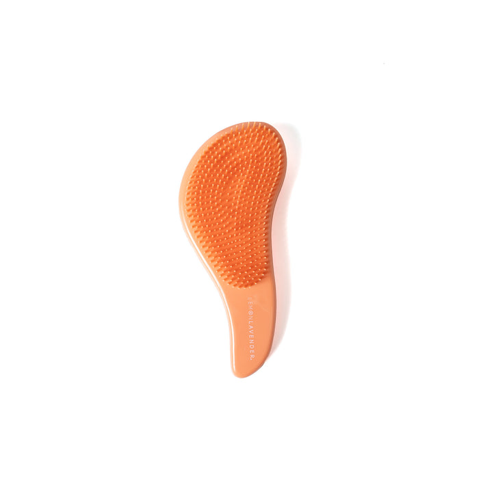 Orange and white hairbrush on a white background